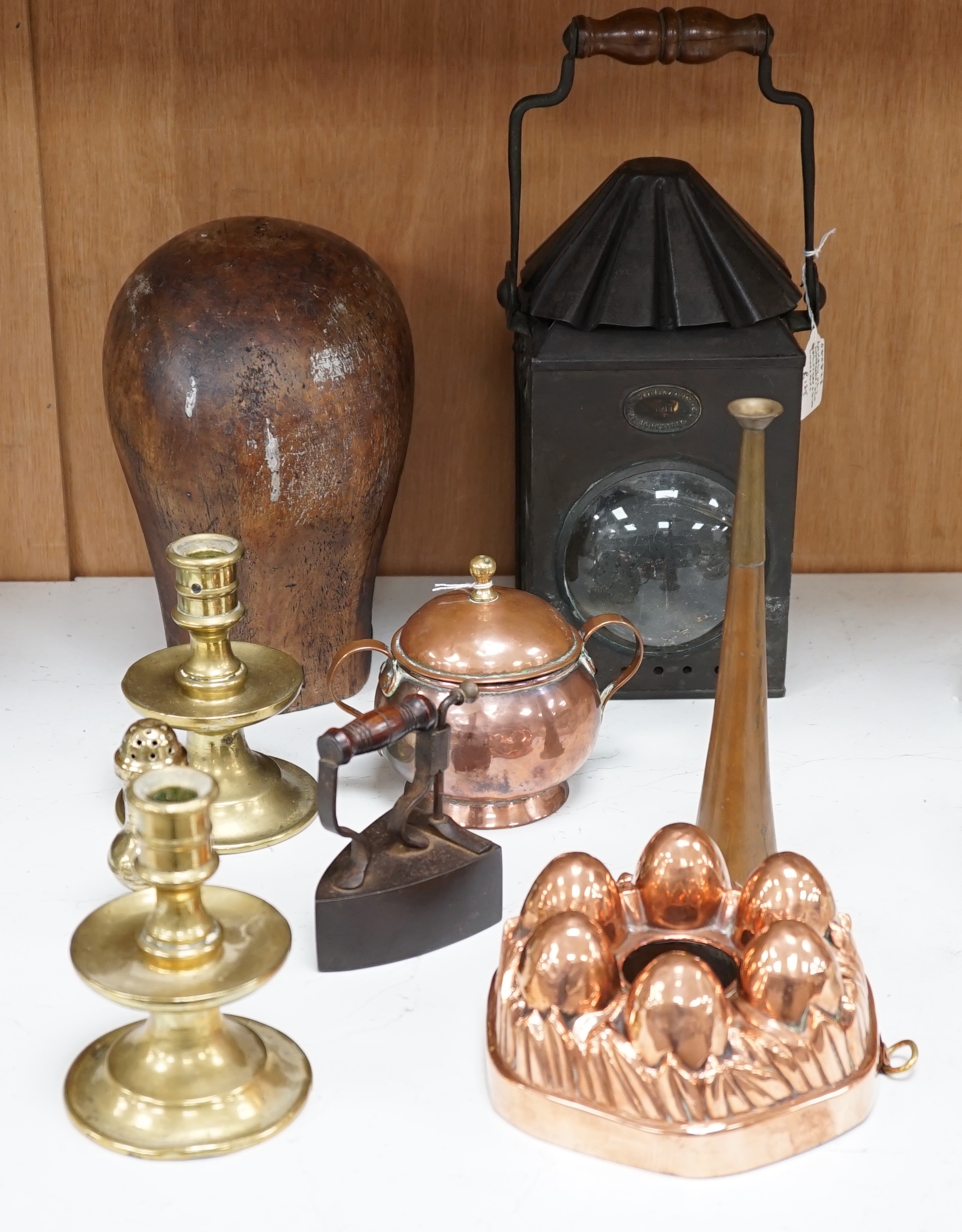 A Toleware lantern, a hatter's block, a copper jelly mould, a slug iron and three other items, tallest 34cm (7). Condition - fair to good